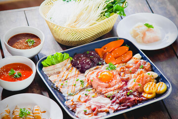Shabu, hot pot, with protein, pork, vegetable dishes, ingredients and mushrooms. Hot pot Asian grilled food BBQ style food