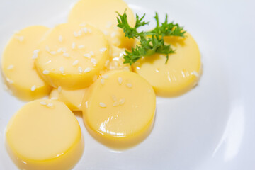 egg of Tofu and sesame seed, on top of Ingredients and raw materials, eating shabu and Sukiyaki on a white plate.