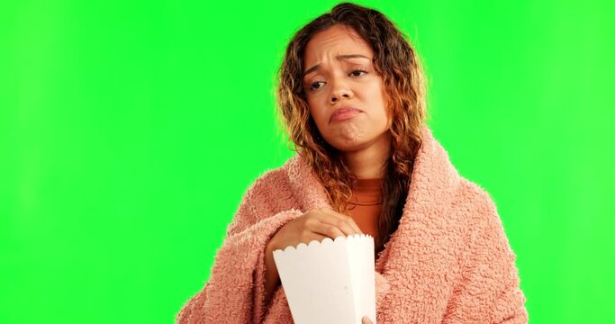 Sad woman, cinema popcorn and green screen eating movie snack and watching tv. Young, depressed female person and upset streaming series in theater with food and lonely with film and television