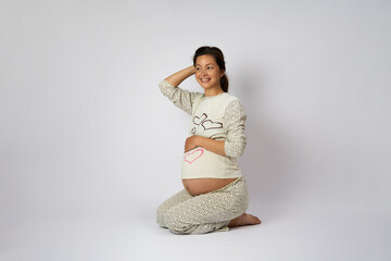 Happy pregnant woman on white background with copy space