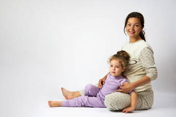 Pregnant mother and daughter are spending time together
