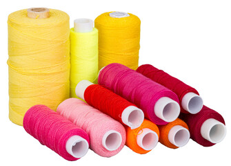 Spools with yellow red pink purple thread for sewing, supply for sewing, isolated objects on white or transparent background
