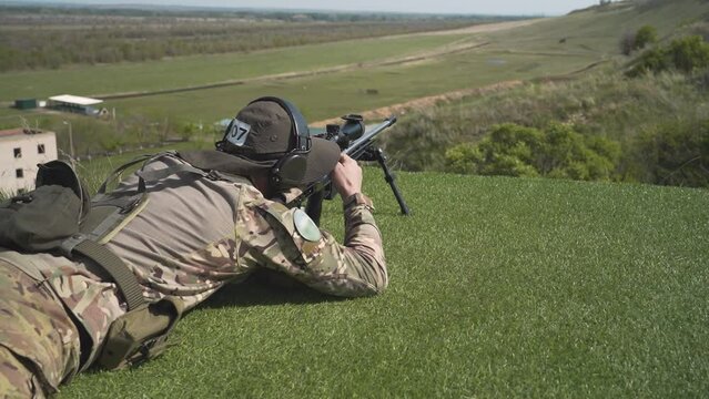 high-precision sniper rifle shooting. the shooter performs the task