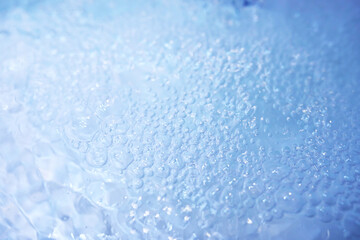 Blue water texture. Bubbles and bubbling water.