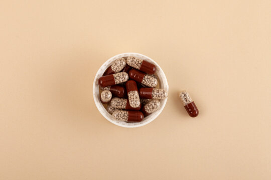 Pancreatin capsules or Creon pills. Pancreatic enzymes, also known as pancreases or pancrelipas reduces absorption of iron from food in the duodenum during digestion