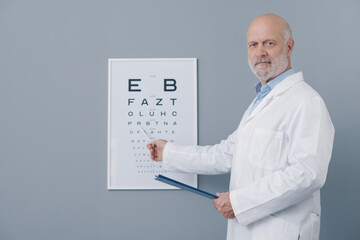 Ophthalmologist pointing at the eye chart