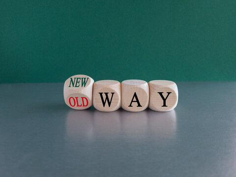 Turned a dice and changes the expression "old way" to "new way". Beautiful green background, copy space. From old way to new way and business concept.