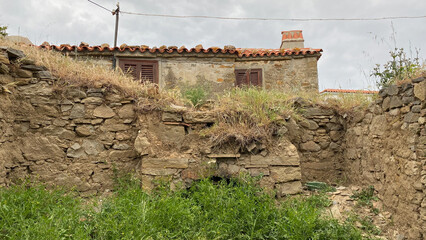 Abandoned, weathered stone house in Gökçeada Old Bademli village. Gliki Village stone houses in Imbros island. Canakkale, Turkey