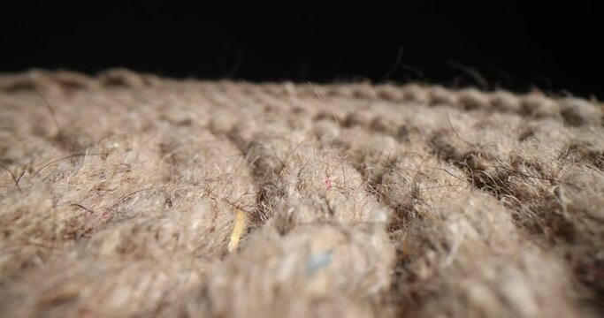Closeup of nautical braided rope on black background. Polyamide braided rope