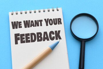 We Want Your Feedback text on notepad - BUSINESS CONCEPT