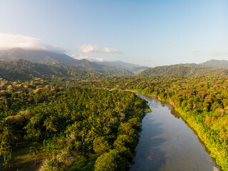 Aerial drone view of the river in the green jungle in Sierra nevada de Santa Marta Tayrona park in colombia 