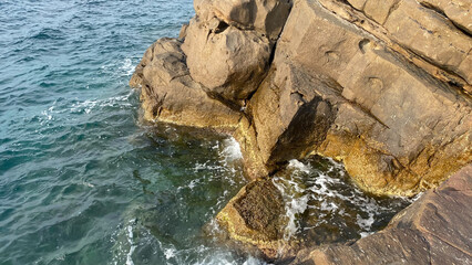 Sea view and volcanic rock fragment from Kaleköy harbor of Gökçeada, the westernmost point of Turkey