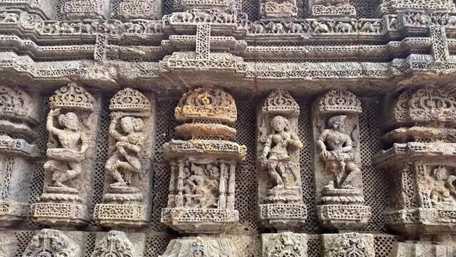 Beautiful carvings on stone in ancient Surya Hindu Temple Konark, Odisha, India