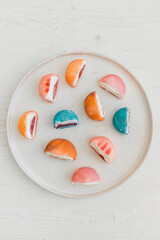 Mochi. Traditional Japanese dessert. Rice cake with filling. Bright original dessert. Sweetness. The filling is shown.