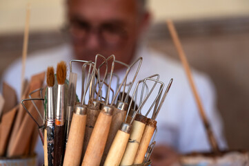 Close-up of tools and brushes for working with clay