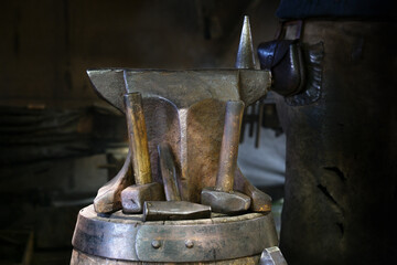 Anvil and various hammers in a portable blacksmith workshop, forge demonstration at a traditional...