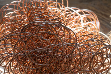 Copper wire springs for furniture seats and mattresses in an upholstery workshop, box-spring...