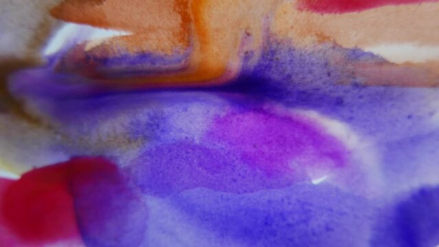 colorful water paint brush detail on white paper