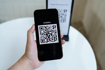 Qr code payment. E wallet. Man scanning tag accepted generate digital pay without money.scanning QR code online shopping cashless payment and verification technology concept.