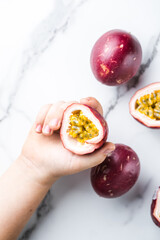 Ripe passion fruit, half and slice of fruit on a white  background.