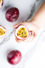 Ripe passion fruit, half and slice of fruit on a white  background.