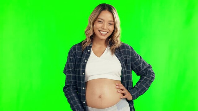 Middle finger, pregnant and rude woman on green screen for body positivity or wellness. Pregnancy, new mother and belly, hand sign or emoji for review problem, empowerment or healthy baby feedback