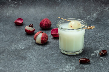 lychee with soda in glass with fresh lychee on a dark background, Restaurant menu, dieting, cookbook recipe top view