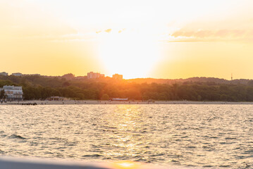 View of the beach from the pier at sunset