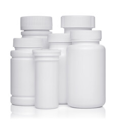 white plastic medical containers for pills isolated on white background
