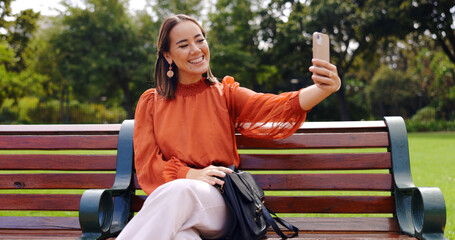 Selfie, smile and Asian woman on bench at park taking pictures for social media. Summer, profile...