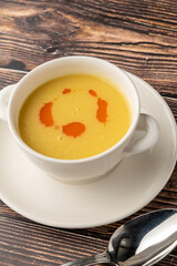 Strained lentil soup on a white porcelain plate