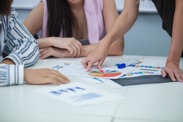 Group of business people brainstorming analyze market graph. at table to work. Effective people in organization use idea to consult their work. employees drive company.