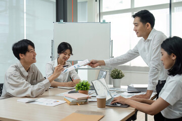 Business team people discussing analyzing investment charts the charts and graphs showing the results of their successful teamwork, typing keyboard, analyze graph plans