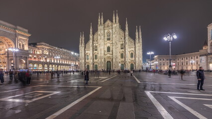 Fototapeta na wymiar Panorama showing Milan Cathedral and Vittorio Emanuele gallery night timelapse.