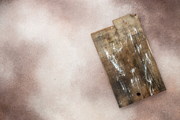 wooden cutting board on concrete background. rustic style, Food cooking background. top view