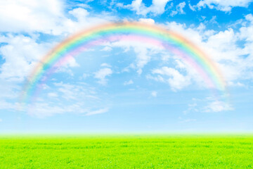 Naklejka premium 草原にかかる虹