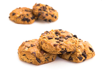 cookies with chocolate and hazelnuts on a white background