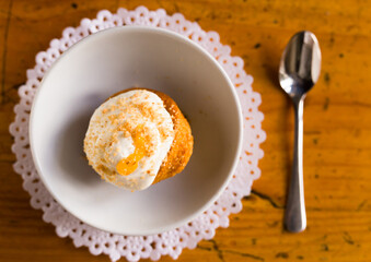 Homemade carrot cake with orange crumbs on plate close-up