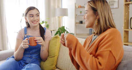 Relax, coffee and friends on a sofa talking, content and bonding on the weekend together. Tea, women and conversation on a couch, smile and chilling in a living room while enjoying comforting drink