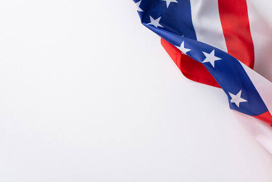 American federal holiday concept. High angle view photo of the flag of United States of America in the right corner on white isolated background with copy-space