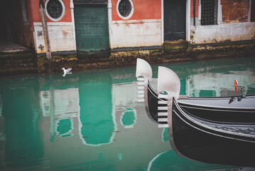 Fototapeta na wymiar Gondolas's embelish in a canal in Venice, Italy