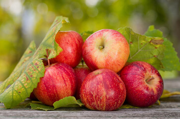 red apples on a wooden table