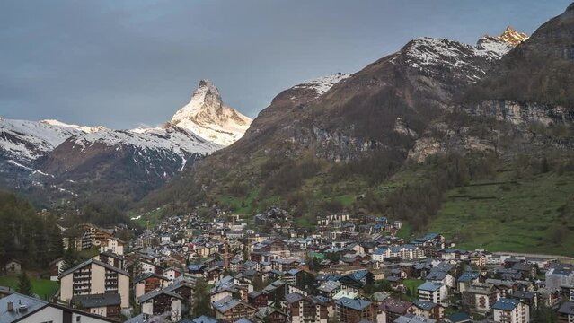 Zermatt Switzerland time lapse 4K, city skyline timelapse at Zermatt city Valley and famous Matterhorn mountain peak