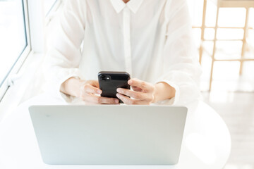 woman work using texting cell phone typing computer.student study education online learning.adult professional chatting on laptop,mobile contact us at Thinking business plan.connecting people concept