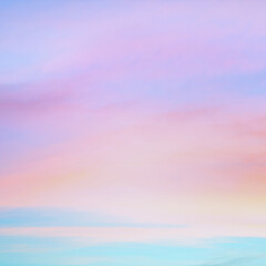 Twilight sky with effect of light in pastel pink, coral, orange, blue tones. Colorful sunset of soft clouds. Background. square