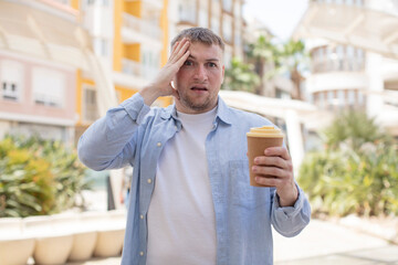 looking happy, astonished and surprised. take away coffee