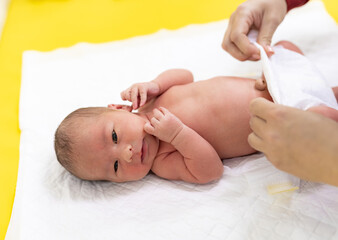 Newborn boy healthcare treatment. Maternity small baby in hospital.