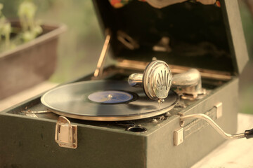 Vintage shot of a retro gramophone with a vinyl record.
