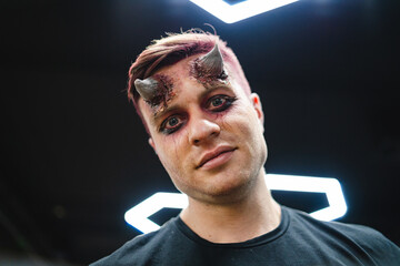 Portrait of scary man with make up. Halloween make up.