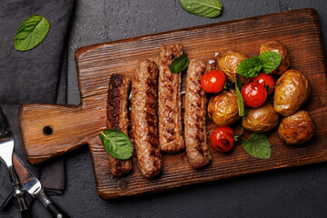 Delicious grilled sausages and potatoes